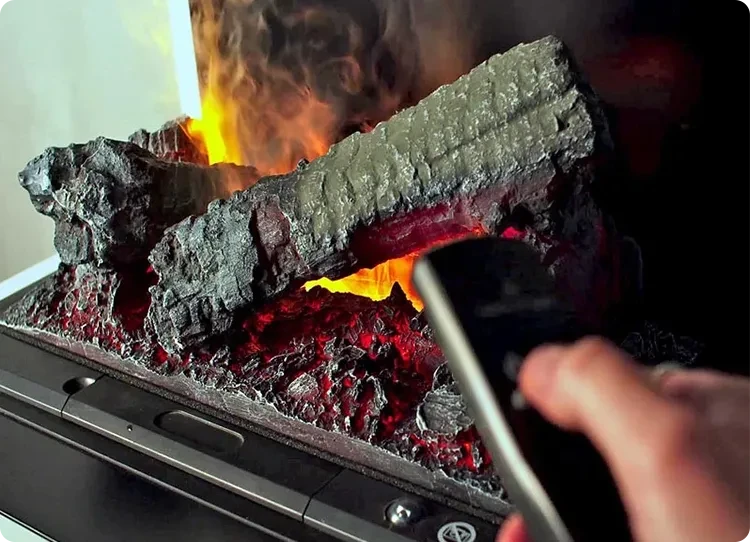 Opti-myst fireplace being remotely controlled