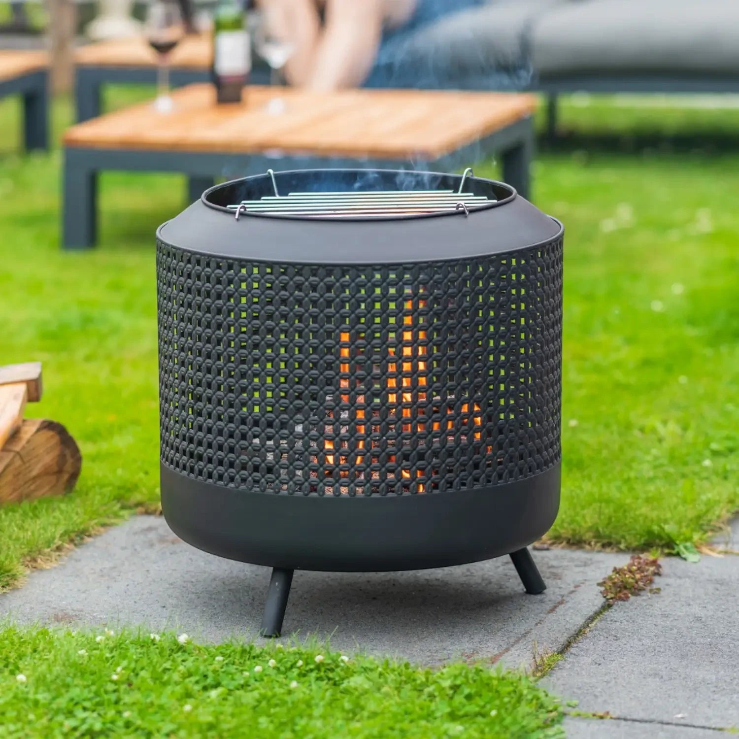 Midland fire basket with grill rack, designed for outdoor heating and cooking with a stylish design