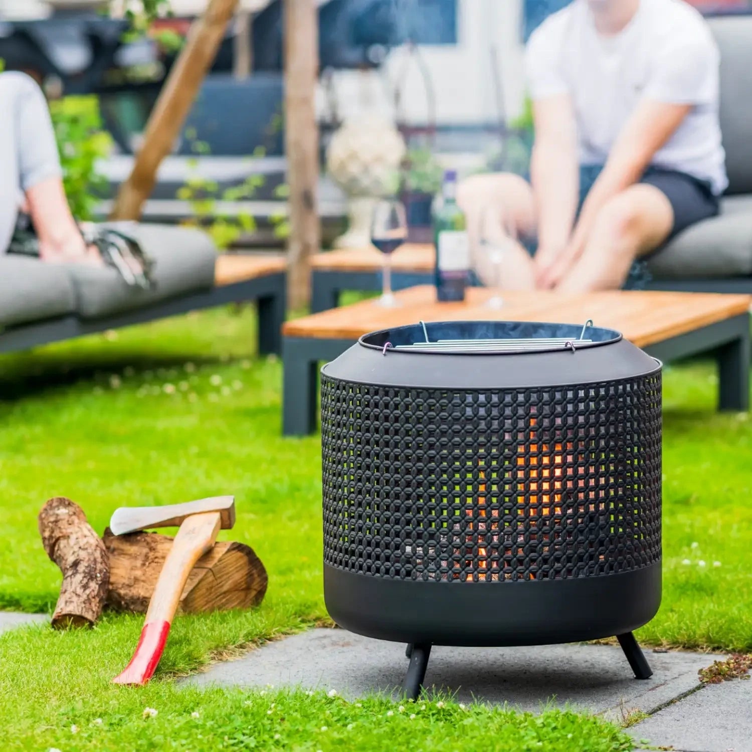 Midland fire basket with grill rack, designed for outdoor heating and cooking with a stylish design