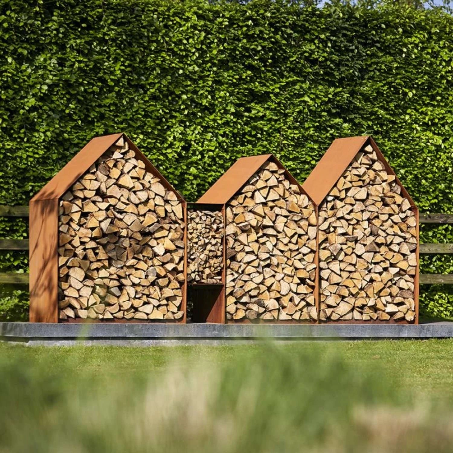 Bruges 3 Houses Log Storage, a spacious and durable solution for storing firewood in outdoor spaces like gardens and patios.
