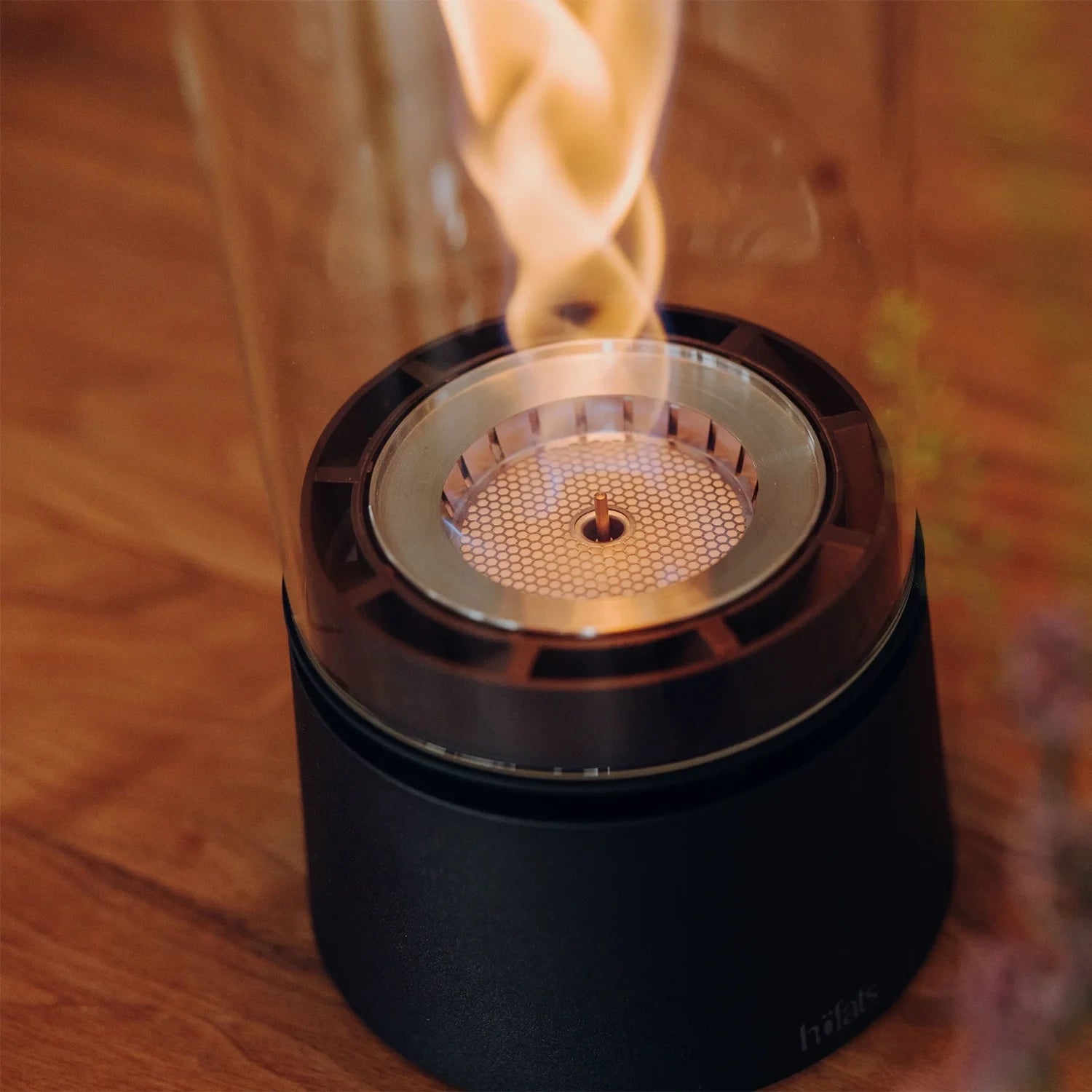 Höfats SPIN Air 1200 - Matt black table bioethanol fireplace with tall cylindrical glass.