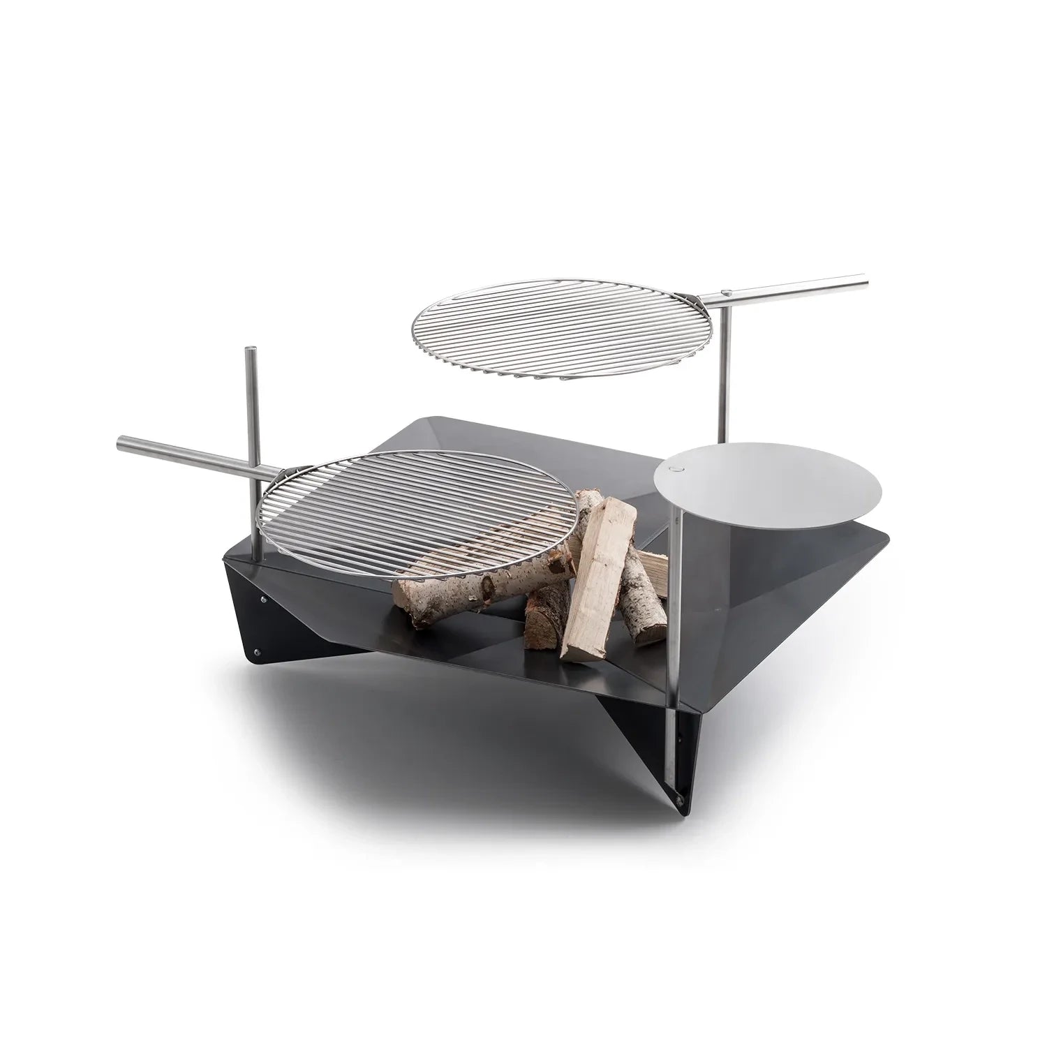 Höfats TRIPLE 120 Fire Pit in Corten Steel with burning logs, placed on a white surface.