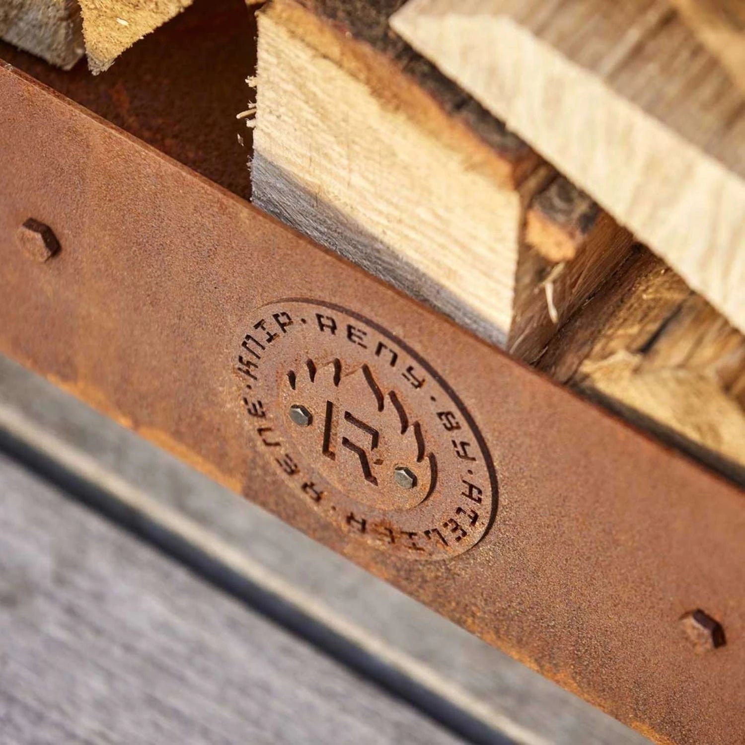 Ker Log Storage, a compact and durable solution for storing firewood in outdoor spaces like gardens and patios.