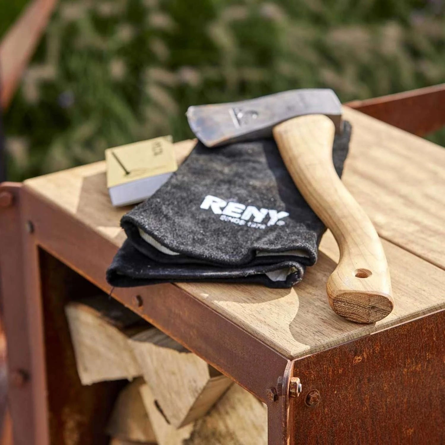 Ker Log Storage, a compact and durable solution for storing firewood in outdoor spaces like gardens and patios.