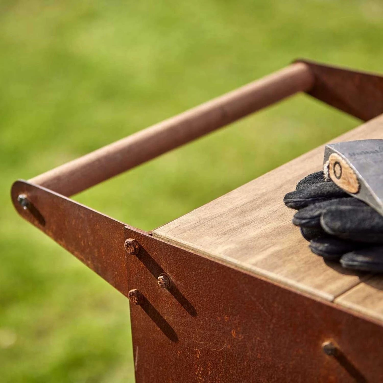 Ker Log Storage, a compact and durable solution for storing firewood in outdoor spaces like gardens and patios.