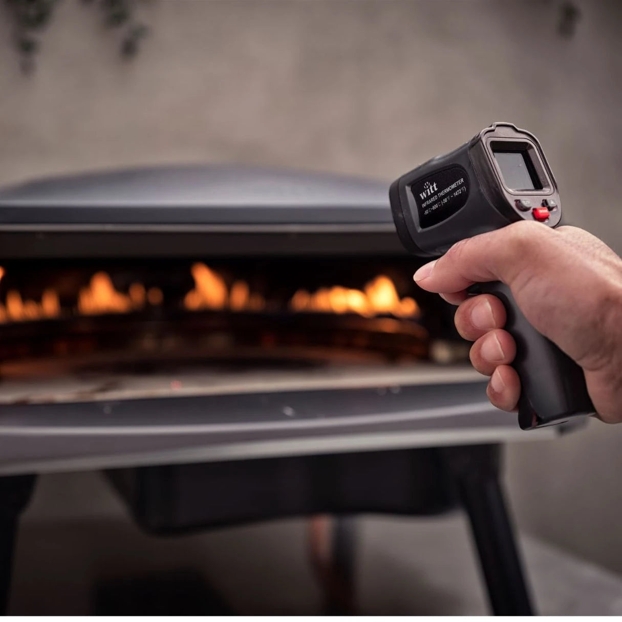 Witt infrared pizza thermometer gun with laser pointer for measuring pizza stone temperature, shown on a white background