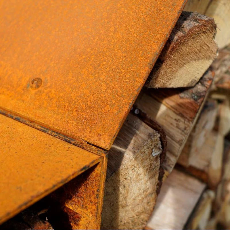 Storage rack for firewood in rusted steel